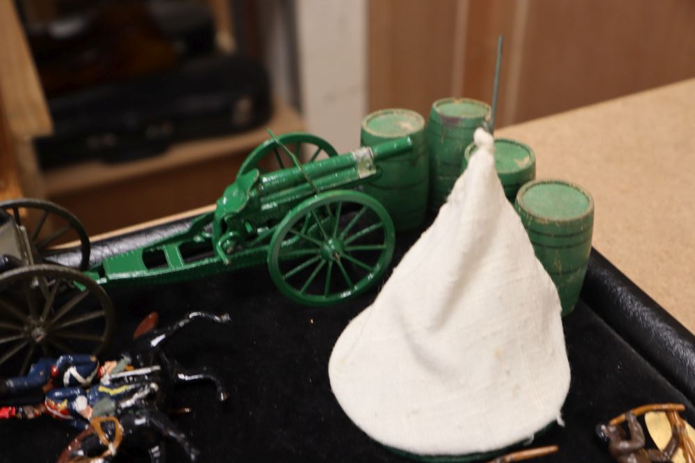 A collection of painted Britains and Holocast lead soldiers, artillery pieces, including some rare dated including Scots Guards chargin
